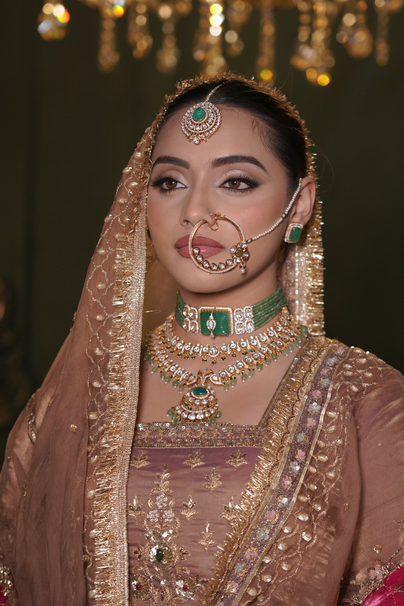 Bridal makeup with kundan jewellery and a gold dupatta