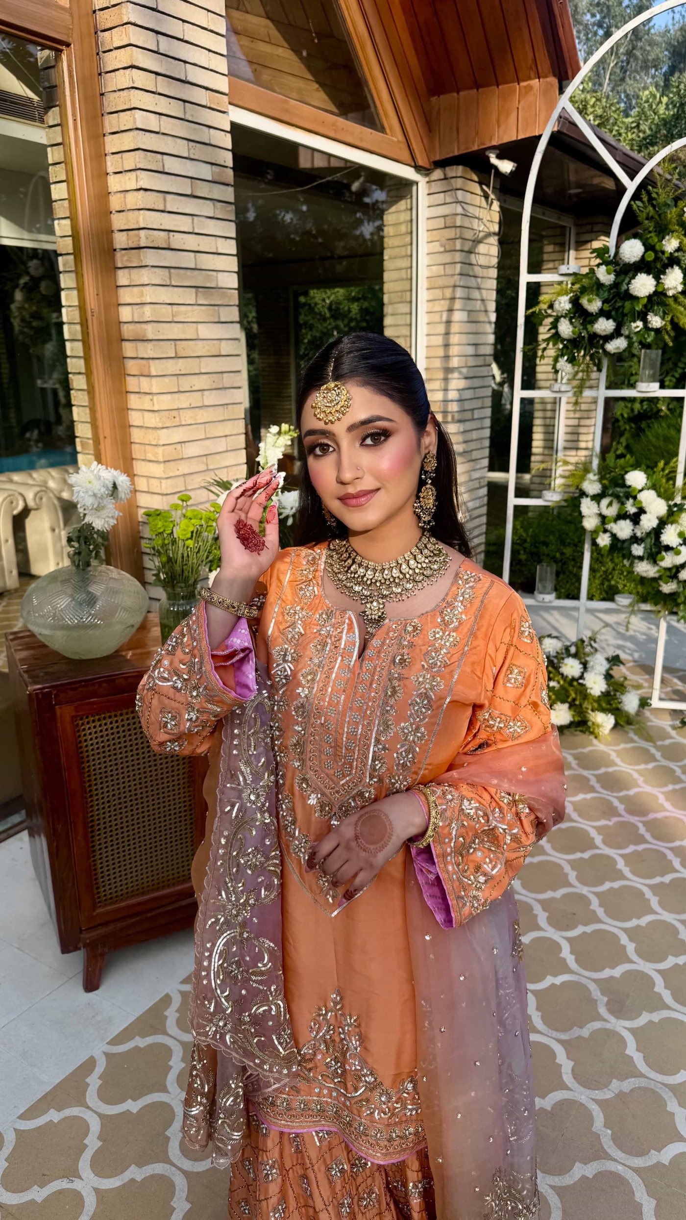 Guest makeup in daylight, orange outfit