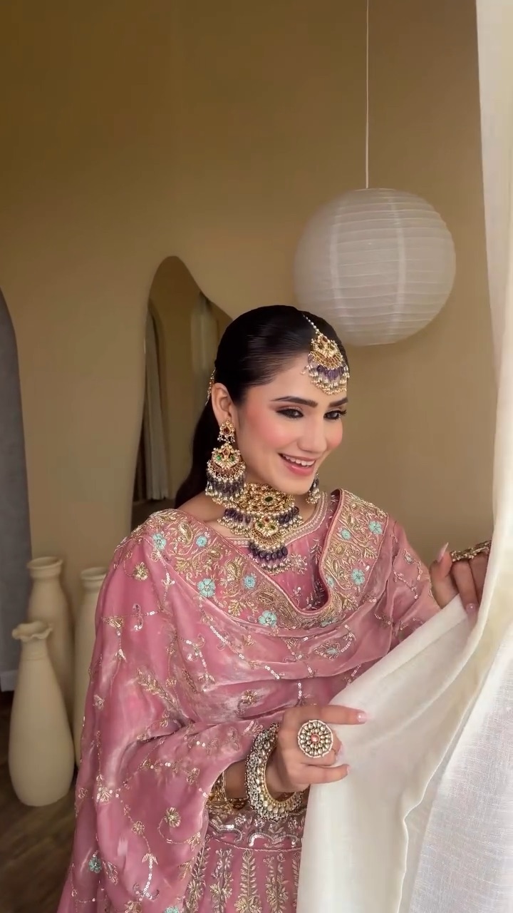 Engagement soft glam makeup in a pink outfit