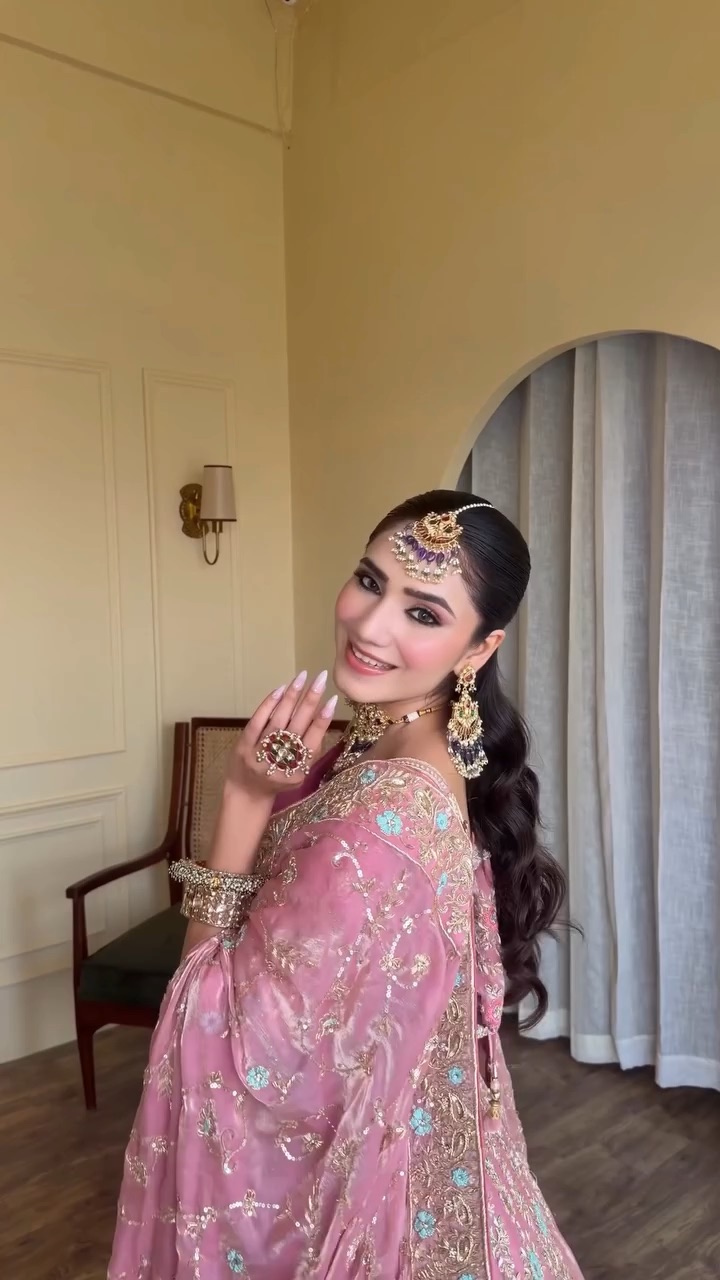 Engagement look with the ring hand raised