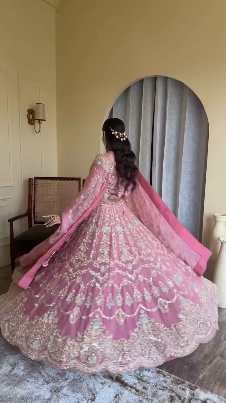 Engagement look, twirling in a pink lehenga